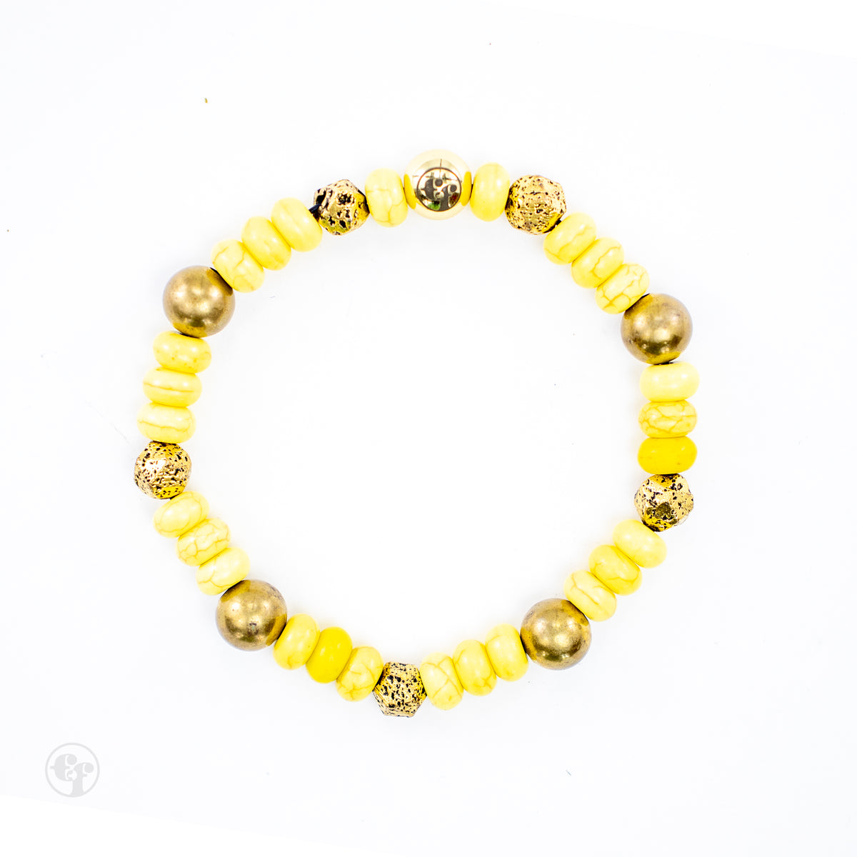 Top view of a yellow bead bracelet showing pale veining, rounded gold-tone accents, textured spacers, and an emblem bead.